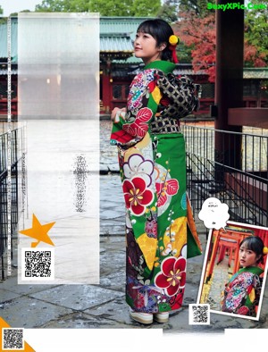 A woman in a colorful kimono is posing for a magazine.